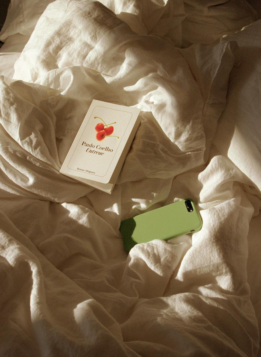 haakon korbi book and iphone on bed for nook society hotel bad saarow